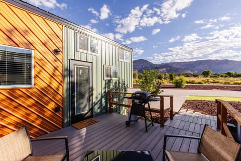 Private deck with mountain views, outdoor seating, BBQ grill, and fire pit. Perfect for relaxing after a day exploring Zion National Park and Southern Utah adventures.