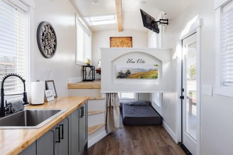 The kitchen is fully equipped with a refrigerator, freezer, microwave, cook-top and sink with hot/cold water. Enjoy coffee from the coffee maker, and find ample counter space, cookware, and storage for all your meal prep needs.