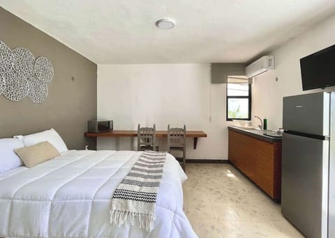 Bedroom with a comfortable king-size bed and blackout curtains