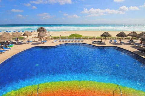 Communal pool area with loungers (aerial view)