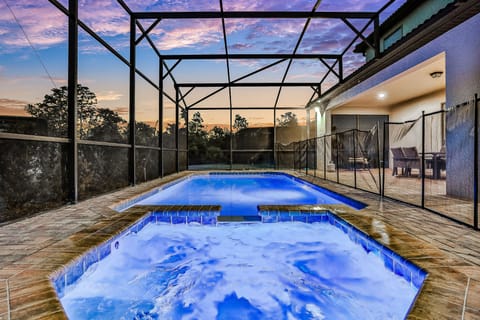 Private, screened in pool with custom lighting