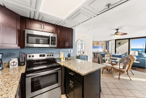 Fully equipped kitchen with granite countertops, stainless appliances, and everything needed to cook at home