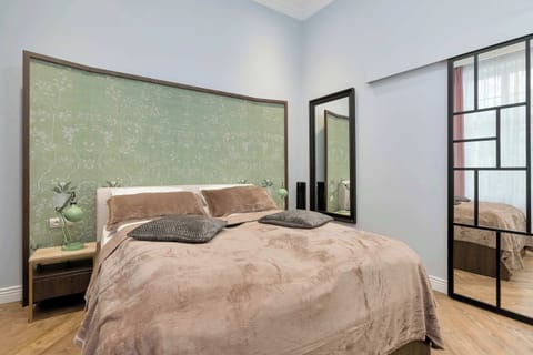 Modern studio living area with double bed.