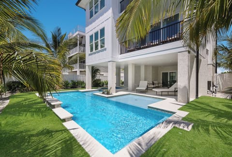 Pool retreat steps from the beach