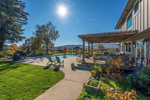 Step into your private backyard oasis with sparkling pool, mountain views, and landscaped gardens perfect for relaxation.