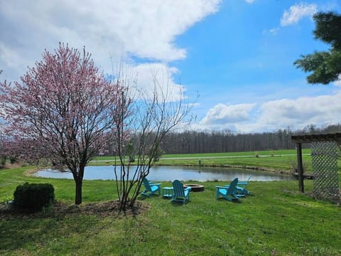 Enjoy a campfire by the private pond