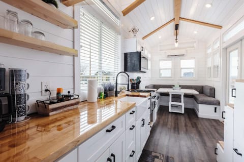 Open-concept kitchen with butcher block counters flows into the dining nook and living space, creating a bright, airy layout perfect for relaxing after exploring Zion.