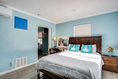 One of the bedrooms in the home with it's own dedicated workspace, mini split to control your own environment, and TV. 