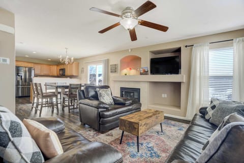 Gather around the cozy fireplace and recessed media center for movie nights or quiet conversation. The functional layout and ample seating make this the perfect central hub for your Colorado Springs retreat.