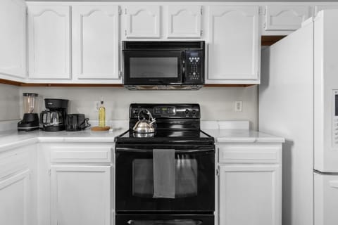 Fully equipped kitchen with coffee maker and dishwasher for easy mornings.