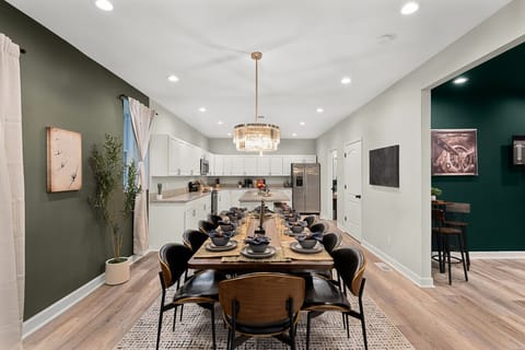 Large Eat-In Dining: Boasting a grand table and high-end decor, this open-concept space is perfect for hosting memorable holiday feasts or celebratory gatherings.