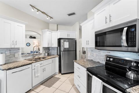 Fully equipped kitchen featuring modern appliances, granite countertops, and plenty of storage for extended stays.