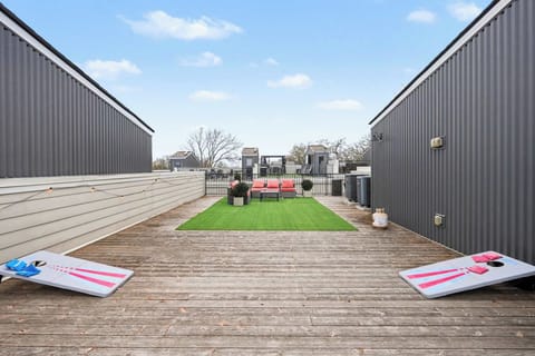 Rooftop patio with grill, corn hole, and views perfect for lounging. | Unit B