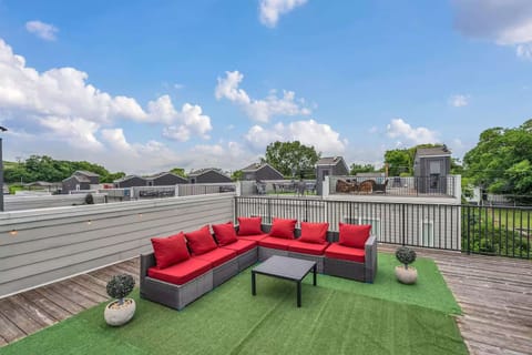 Rooftop patio with grill, corn hole, and views perfect for lounging. | Unit C