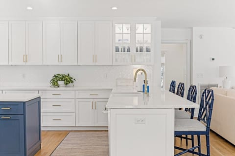 GREAT ENTERTAINMENT AREA WITH BAR STOOLS AND OPEN TO LIVING AND DINING