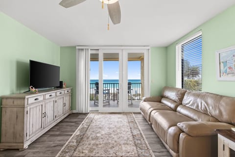 Relax in the airy living room w/ sweeping ocean views & a private balcony just steps away.