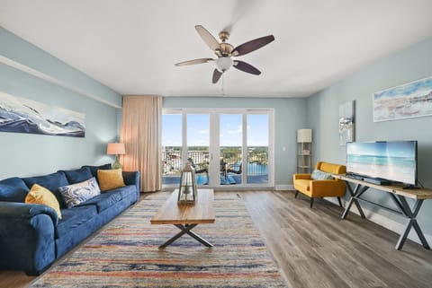 Relax in this modern living room with waterfront views and natural light.
