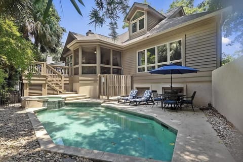 Beautiful vacation home with private pool surrounded by tropical landscaping and spacious outdoor entertaining areas.