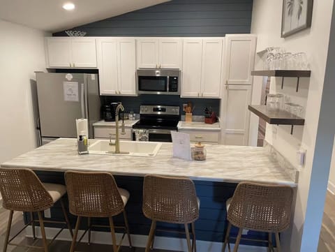 Fully stocked Kitchen with bar / 4 barstools