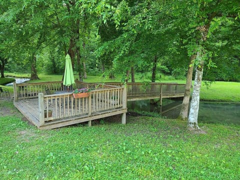 Mini deck across from the cabin with bridge leading to peninsula