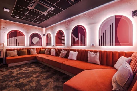 Modern communal cinema lounge at Valore Living Birmingham, professionally managed serviced accommodation by Valore Property Services.