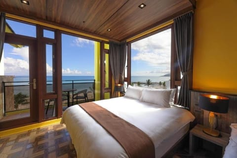 Deluxe Quadruple Room, 2 Queen Beds, Balcony, Sea View | Minibar, individually decorated, individually furnished, soundproofing