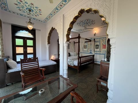 Luxury Suite, Garden View | In-room safe, desk, laptop workspace, iron/ironing board