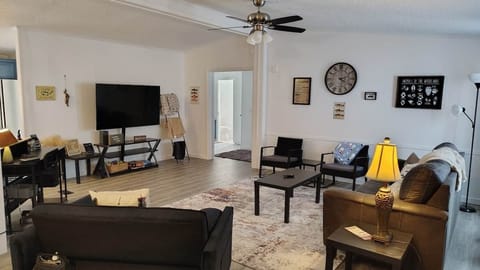 Spacious living room with queen sofa sleeper at Norfork Lake vacation rental