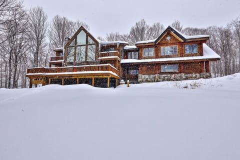 Ski-in/ski-out log cabin on Great Eastern Trail, with four bedrooms across three levels.