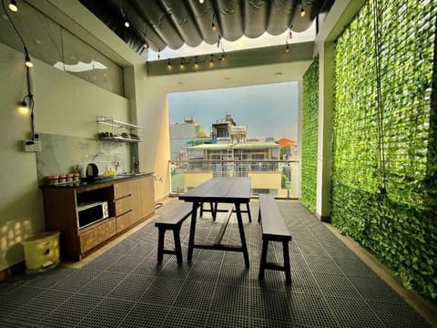 Deluxe Quadruple Room, Balcony, City View | Outdoor dining