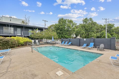 Communal pool for guest use with ample seating on pool deck