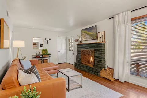 Cozy up in front of the fireplace on the leather sofa. Large front window brings in great natural light. 50"TV Netflix and Amazon Prime Video are provided.