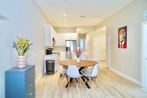 Large living room area integrated with dining and kitchen.