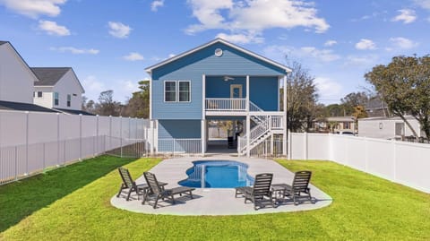 Private fully fenced backyard features pool, sun loungers, and plenty splash area for the kids.