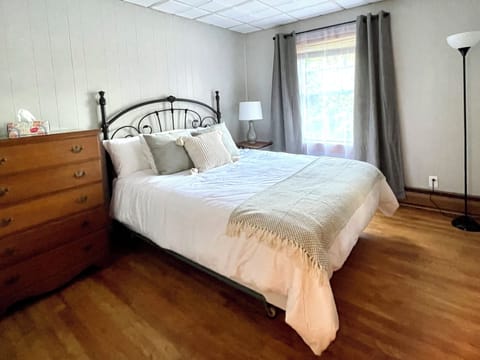 Comfortable queen bedroom with lots of natural light.