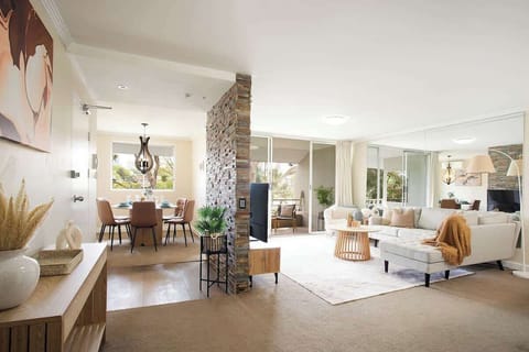Living Room: Modern elegance awaits with stylish décor, natural light, and serene garden views!