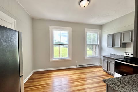 View of kitchen from living area - windows overlook Barnhardt Circle Park
