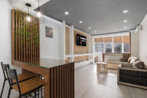 Deluxe Apartment, City View | Living area | Flat-screen TV