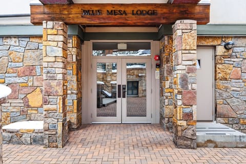 The welcoming stone-pillared entrance of Blue Mesa Lodge.