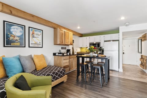 Studio space featuring a daybed and a modern kitchen island.