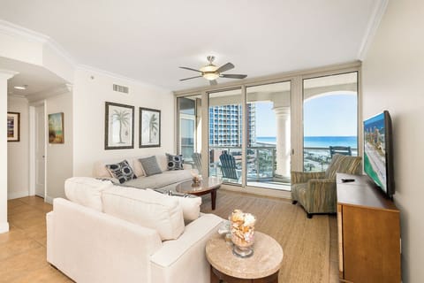 Unwind in your bright living room with sweeping Gulf views, plush seating, and coastal breezes from your private balcony.