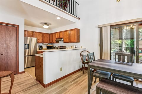 Your open kitchen flows into the dining space, perfect for cooking and sharing meals together in this bright, two-story retreat.