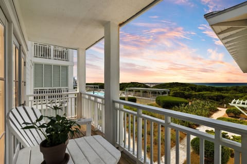 Stunning sunset views from this covered balcony overlooking landscaped grounds and natural coastline.