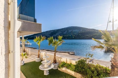 Deluxe Villa, Balcony, Beach View | Property grounds