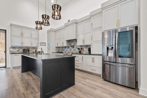 Upgraded kitchen with fully stocked cooking essentials.