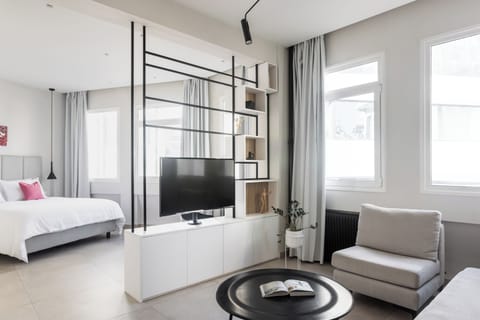Living room with bedrooom in the background