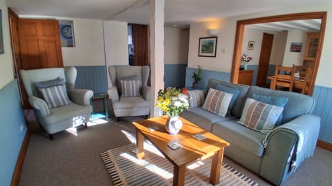 Relax in the comfortable lounge with original beams.