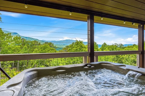 Covered hot tub deck perfect for relaxing year-round