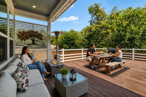 Spacious outdoor deck with comfortable seating—perfect for relaxing, dining.