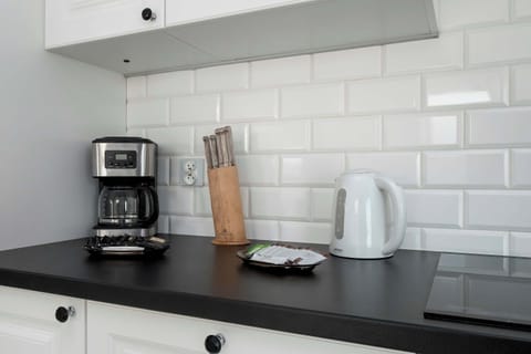 Cook and dine in style with the modern kitchenette and dining area.